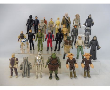 27 vintage Star Wars figures to include R2D2, C3PO and others.