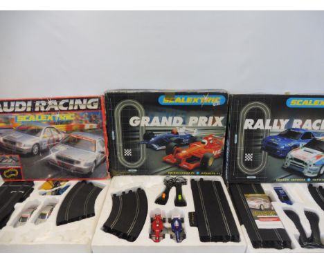 Three large scale Scalextric sets: Audi Racing, Grand Prix and Rally Racing, unchecked. 