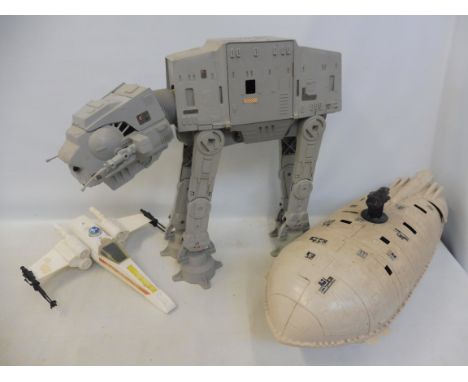 Vintage Star Wars playworn models from the first three films including an Atat, a Rebel Transporter, an X Wing. 