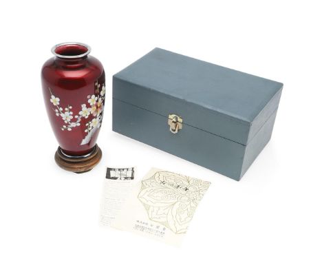 A 20thc boxed cloisonne vase, decorated with a flowers and leaves on a red ground. In a fitted box and with a certificate and