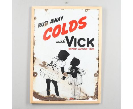 A vintage pictorial sign, 'Rub away Colds with Vick Brand Vapour Rub', the sign with two children. With various pierced holes