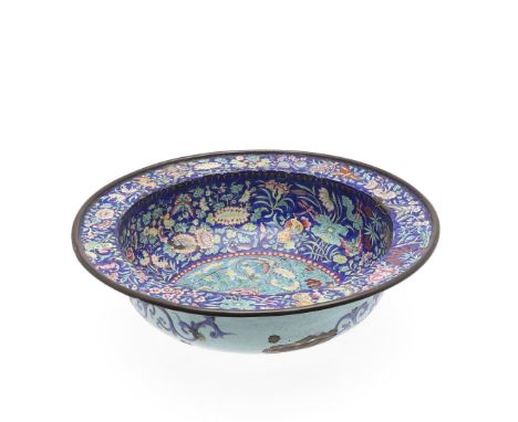 A 19thc large deep basin with flat rim and brass band around the outside, the interior profusely decorated with flowering pru