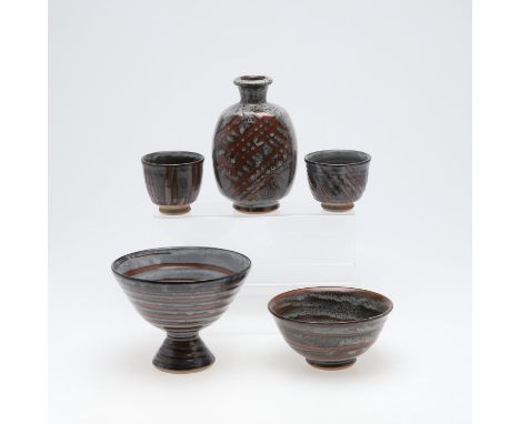 A mixed lot including a bottle shaped vase with criss cross design to each side (20cms high), a pedestal bowl with spiral des