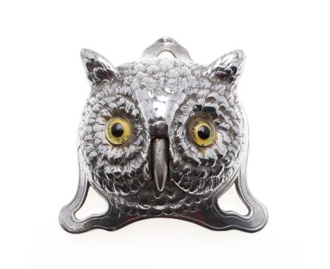 An interesting chrome plated door bell or table bell in the form of an Owl, with the beak operating the bell and with glass e