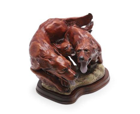 An unusually large bone china group of 'Red Setters at Play', part of the Canine Capers Series. One of only 3 groups made (th