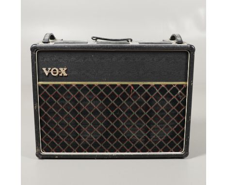 A large Vox AC 30 twin guitar amplifier, Serial Number 3550, with various input sockets and switches and carrying handles. 69