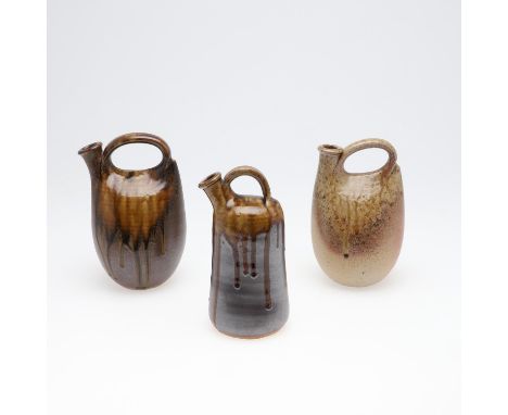Each of sack form, and with a partial green drip effect glaze on a stoneware body. Each with impressed marks for the Muchelne