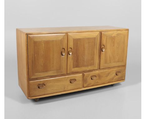 A vintage light elm sideboard with two door cupboard and internal shelf, with a single door with cutlery tray and with two dr