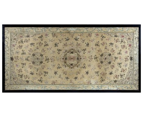 An unusually large late 19thc/early 20thc Chinese yellow silk panel, profusely embroidered with floral medallions, and variou