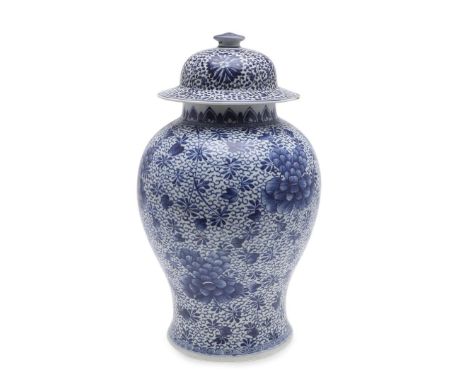 A Kangxi period (1662-1722) large baluster shaped jar, profusely painted with peony and other flowers and foliage. With a dom