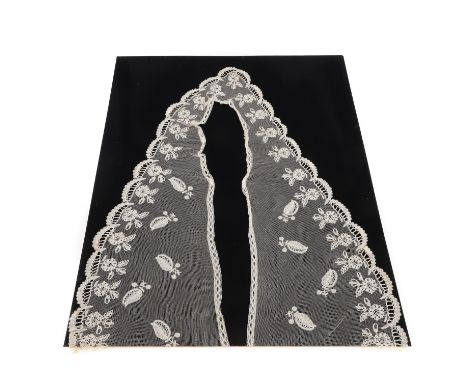 A 19thc Honiton lace bertha, mounted on a piece of black card. With associated provenance linking this item to Queen Victoria