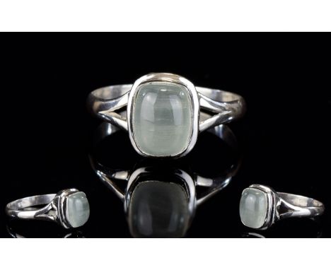 Aquamarine Cabochon Solitaire Ring, a cushion cut natural aquamarine of 2.3cts, in a silver bezel setting; size Q