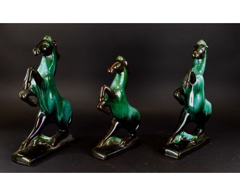A Collection Of Green/Black Blue Mountain Horse Ceramic Figures comprising of two large and one medium. The largest being 8.5