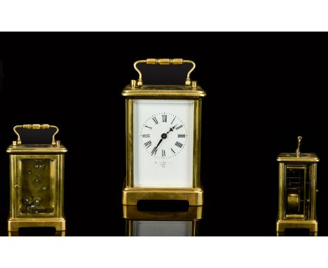 A Brass 4.5 Inch Tall Carriage Clock with Bevelled Glass, In Good Order and Working Condition, Complete with Original Key. 
