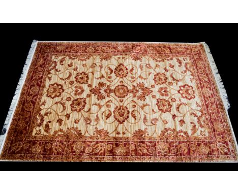 A Very Large Woven Silk Carpet Large Zeigler carpet, red ground with repeated red floral and foliate design and matching red 