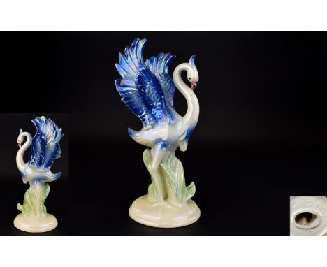 Jenna Holland Stylised Ceramic Heron Bird Figure. Numbered 266, sage green leaves and cobalt blue wing detail. the whole, fin