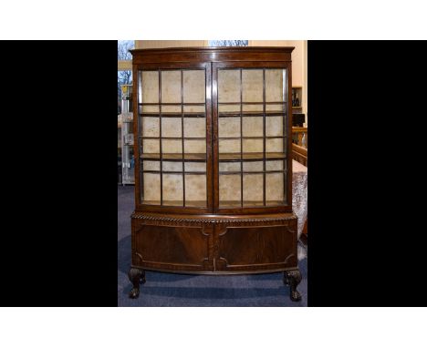 Victorian Period - Mahogany Carved Impressive Bow Fronted Display Cabinet of Large Proportions. The Two Large Glass Panel Doo