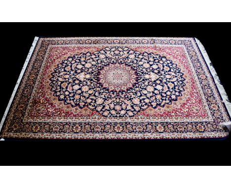 A Large Woven Silk Carpet Keshan rug with beige ground and traditional Middle Eastern floral and foliate border detail with c