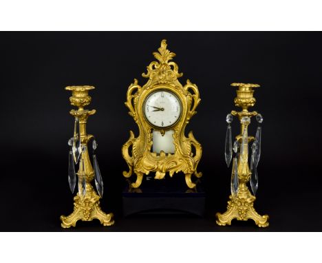 Westclox- Nice Quality And Attractive Gilt Metal Clock Garniture Set. Circa 1900-1910. An Ornate Clock with alarm. The candle