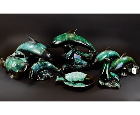 A Collection Of Green/Black Blue Mountain Ceramic Marine  Figures comprising of four dolphins, two seals, one salmon, one gup