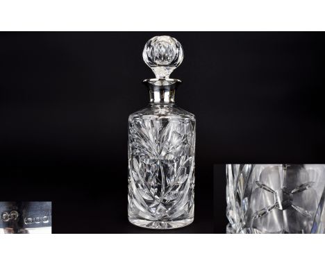 Edwardian Silver Collared Cut Crystal Decanter. Hallmark London 1912, Deep Cut Stylished Floral Decoration. Height 10.5 Inche