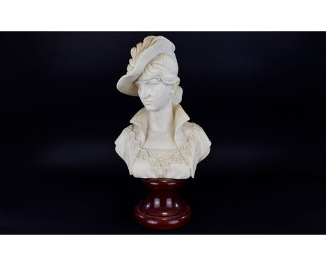 A Reproduction Art Nouveau Resin Bust In The Form Of Finely Attired Female Resin bust cast to resemble marble, raised on a ci