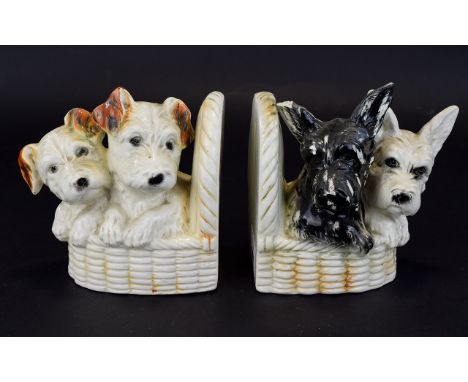 Two Antique Book Ends with Two breeds of Dogs on each side, small chip to ear. 