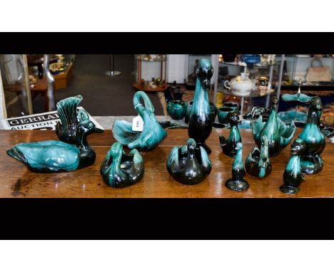 A Collection Of Green/Black Blue Mountain Bird Ceramic Figures comprising of six ducks and six swans. The largest being 12inc