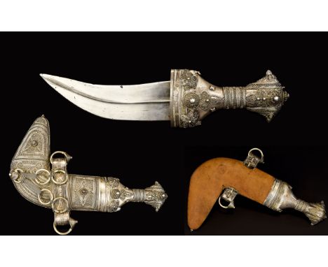 An Ornamental Wirework Kukri Decorative Gurkha knife with ornate handle and intricate wire work scabbard with leather backing