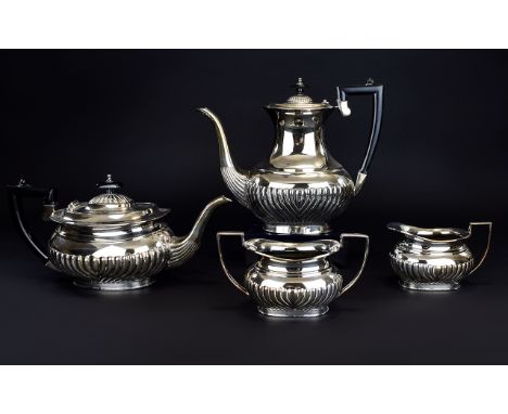 Antique Period 4 Piece Silver Plated Tea And Coffe Service with half ribbed bodies. Comprises of 1 Teapot, 1 Coffee Pot, Milk