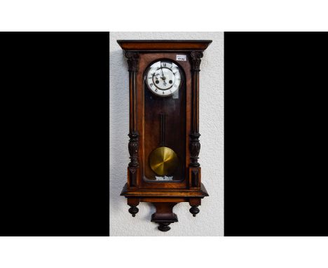 Vienna Wall Clock of typical form, white enamel dial, Roman Numerals, spring driven movement with pendulum. 
