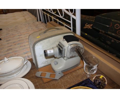 A projector sold as collector's item together with a screen 