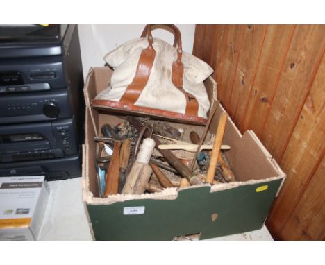 A box containing various upholstery tools
