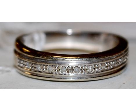 A modern 9ct gold and small brilliant cut diamond set half hoop eternity ring, 3.7g