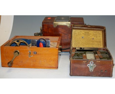 A cased Magnetto electric machine; together with a Circuit Testing Ohmmeter; and a wooden cased Record Ohmmeter (3)