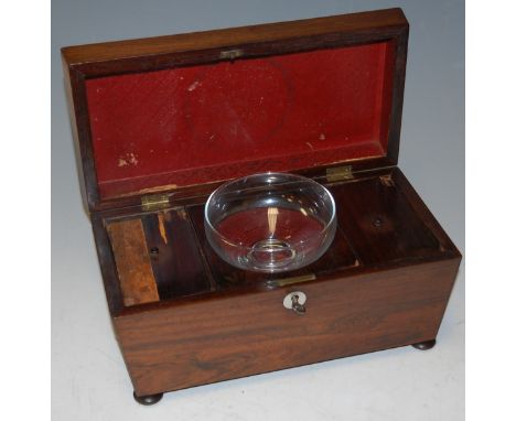 An early Victorian rosewood tea caddy of sarcophagus form on bun feet