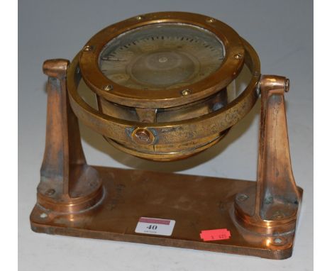 A mid-20th century brass cased ships compass, mounted on a gimbal, numbered 418A-49 AFT