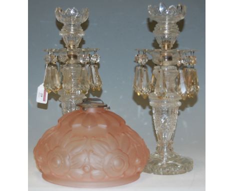 A pair of early 20th century glass table lustres with prism drops; together with a pink moulded glass ceiling light fitting (