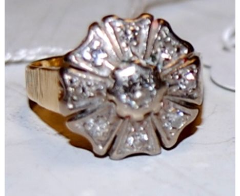 An 18ct gold and diamond set flowerhead cluster ring, with textured band