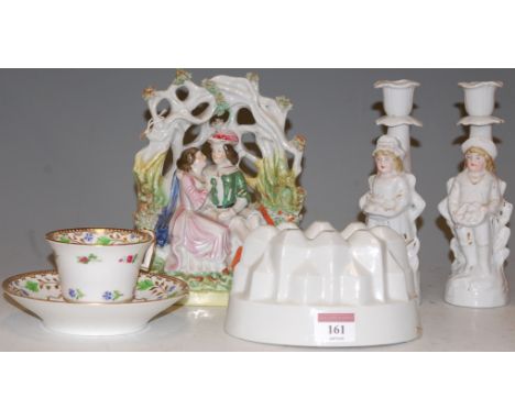 A Victorian Staffordshire Bocage figure group together with 19th century tea cup and saucer, pair of  figural candle sticks a