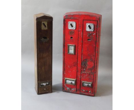Two enamel cigarette vending machines, early 20th century, one with twin dispenser 'Wild Woodbines 2d' and '6d', the second r
