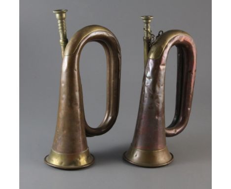 A WWI Boosey &amp; Co. military bugle and a WWII Hy. Keat &amp; Sons military bugle, dated 1914 &amp; 1940, the former indist