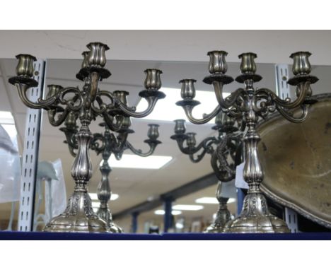 A pair of ornate Italian 800 white metal six light five branch candelabra, height 35cm, gross 78.5 oz.