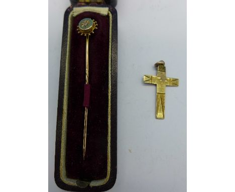 A 9ct gold and diamond stick pin, boxed and a 9ct gold cross, 1.7g