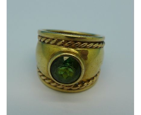 A 9ct gold and green stone ring, 7.6g, K