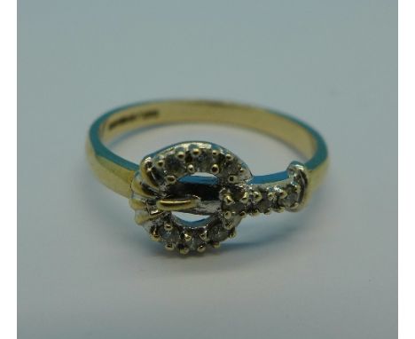 A 9ct gold and diamond buckle ring, 1.9g, M