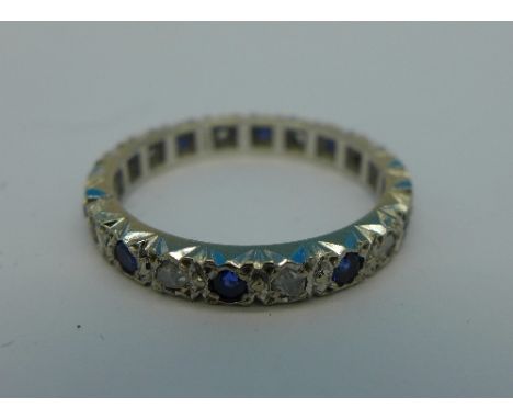 An 18ct white gold, sapphire and old cut diamond eternity ring, 3.2g, M