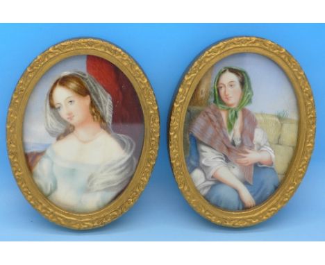 A pair of painted portrait miniatures in oval frames, height of frames 11.5cm