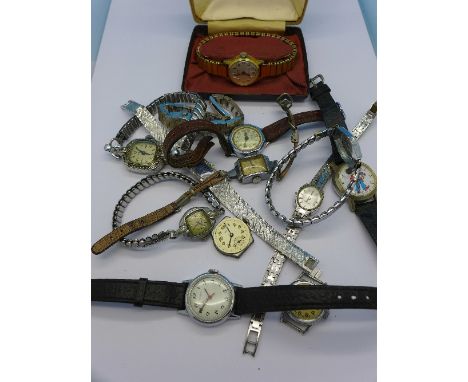 Twelve mechanical wristwatches including Marvin, Rotary, Ingersoll, cased, and Mickey Mouse, etc.
