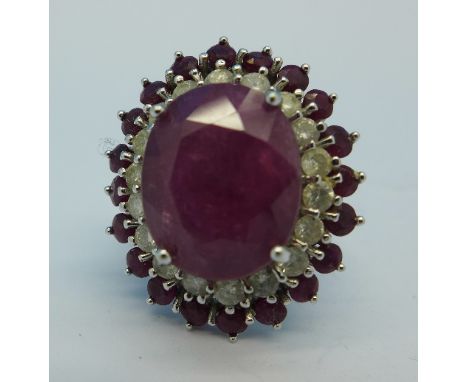 A 14ct white gold, diamond and ruby ring, 10g, O